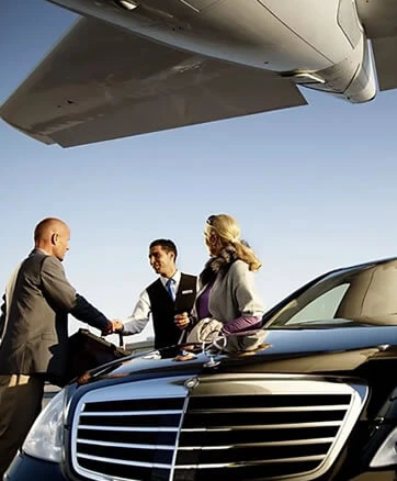 a picture of people with a car and a plane